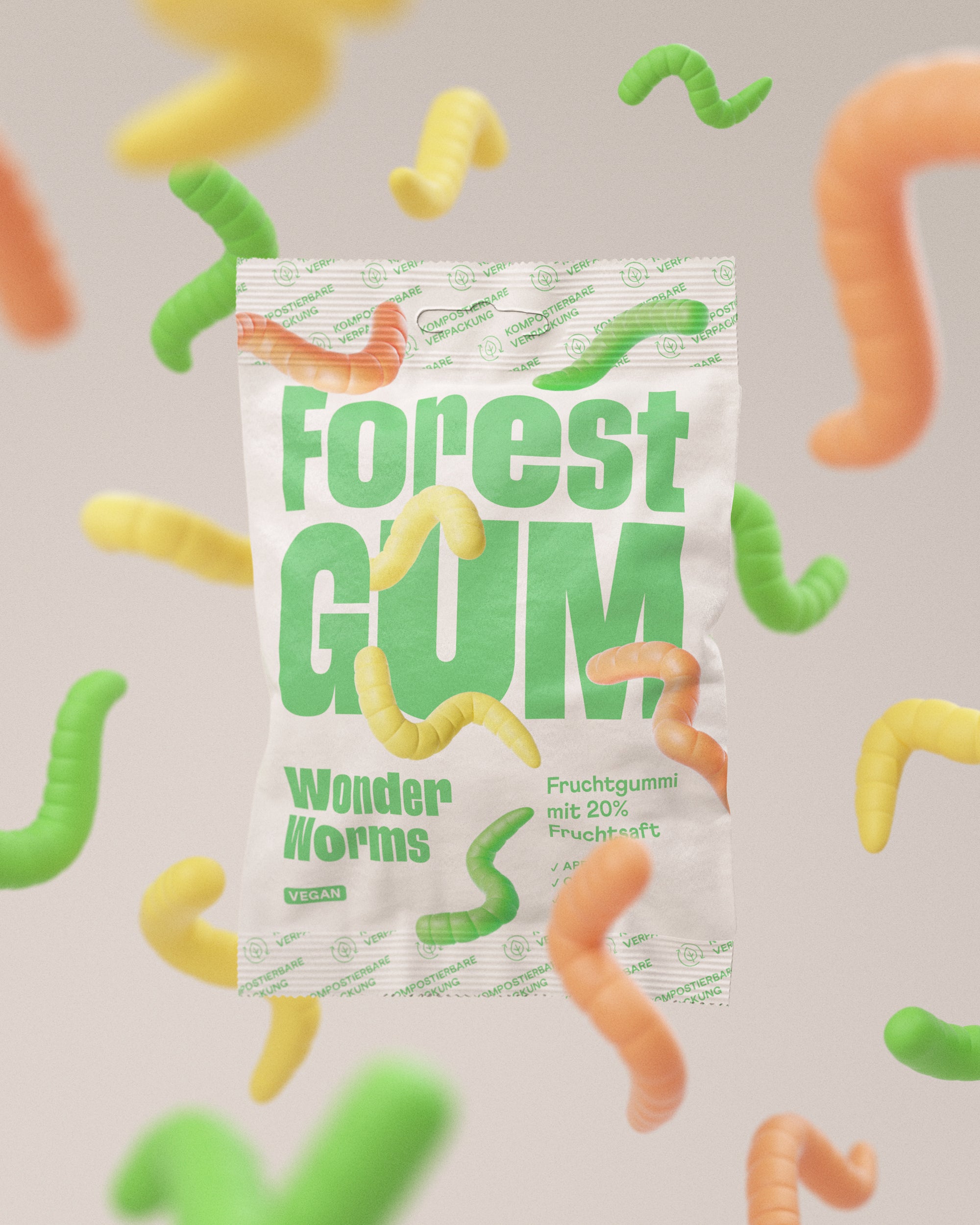 Eine Packung Forest Gum Wonder worms, Vegane saure Fruchtgummis umgeben von schwebenden Fruchtgummi Würmer